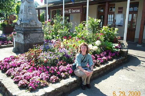 Dorothy Sitting By Flowers In Yvoire